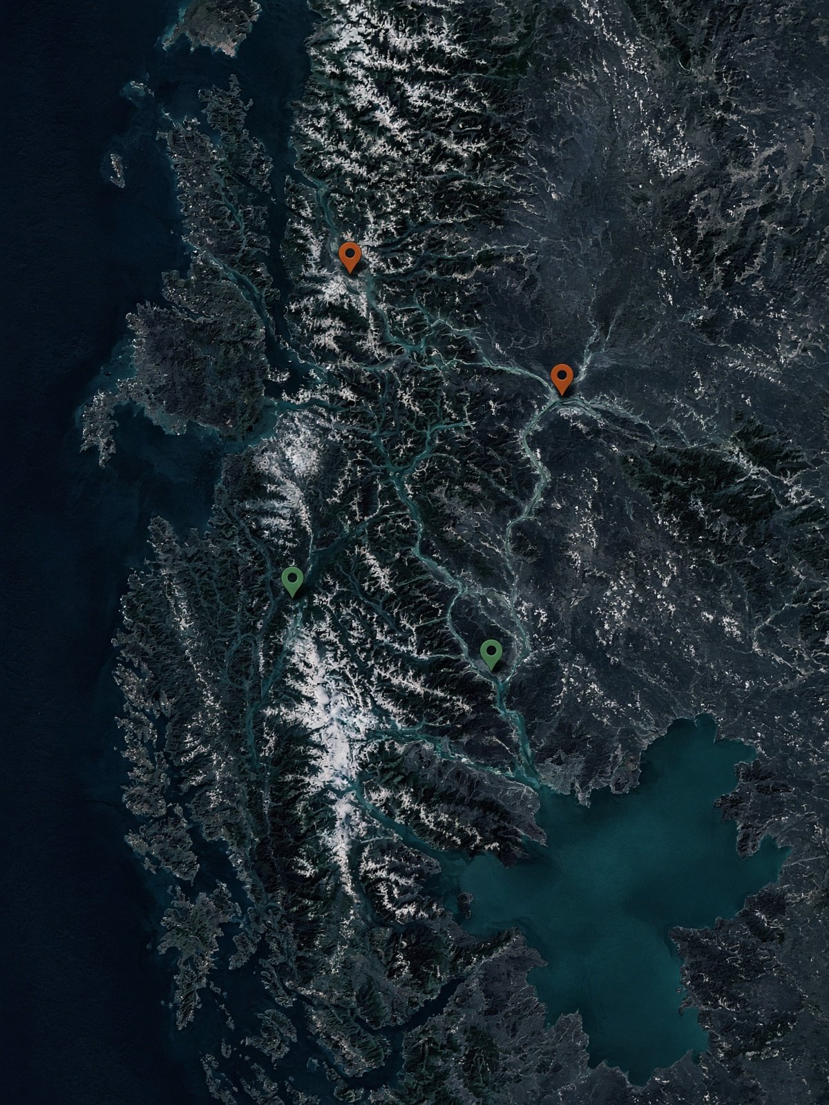 Dark topographic map of Aysén with river pins